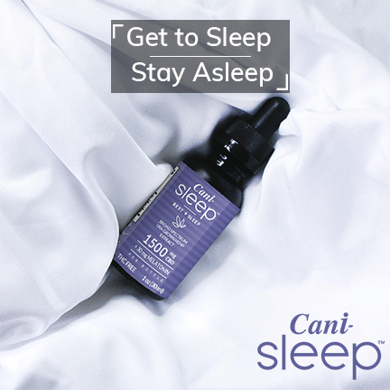 Alt=“CBD sleep oil tincture placed on white bedsheets”