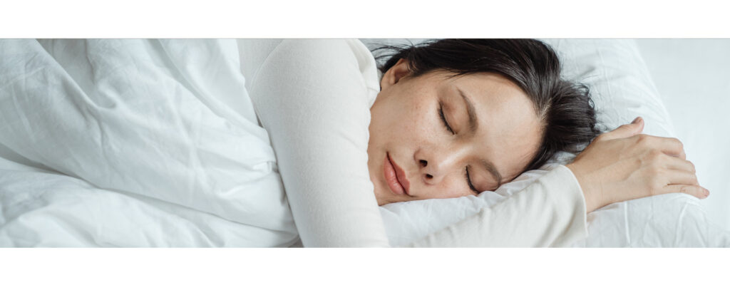 Alt=“woman sleeping peacefully”